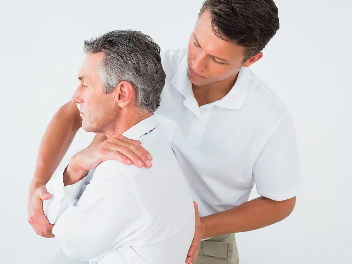 Professional Physiotherapist Correcting A Posture In Brooklyn