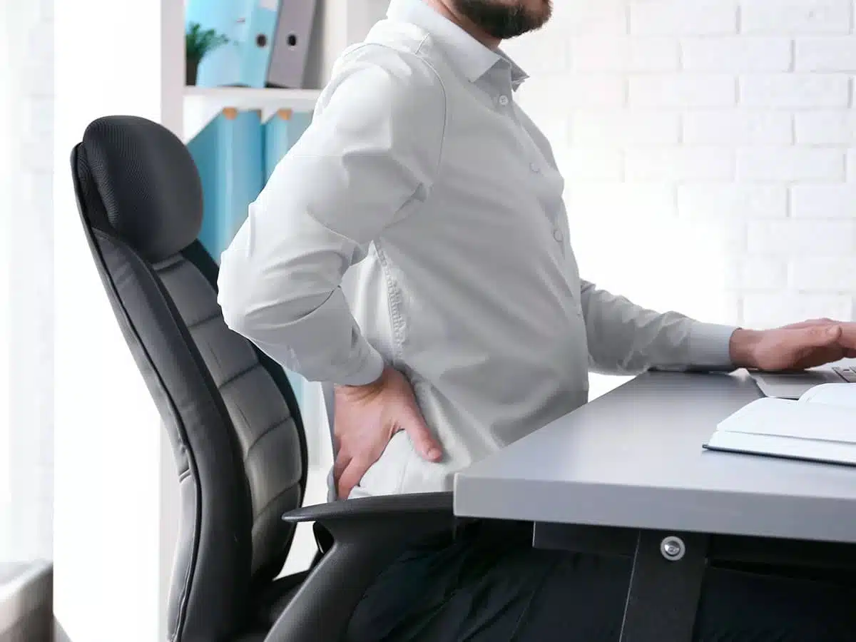 Man Having Back Pain For Having A Bad Posture In Brooklyn