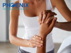 Physical therapist treating wrist Joint Pain during rehabilitation session