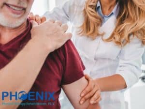 Physical therapist evaluating shoulder Joint Pain during treatment session