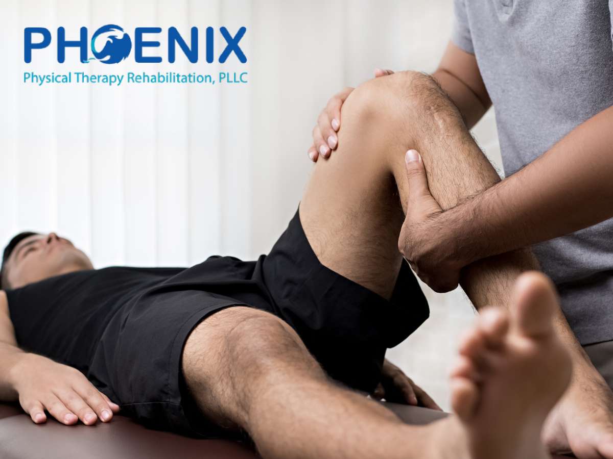 A Certified Physical Therapist treating a patient's knee at Phoenix Physical Therapy Rehabilitation, PLLC