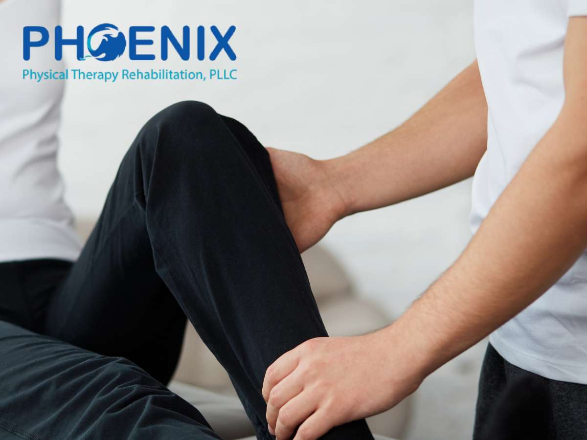 Therapist providing physical therapy for a patient's knee at Phoenix Physical Therapy